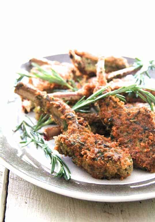 Parmesan and Herb-Crusted Lamb Chops on gray-rimmed platter.