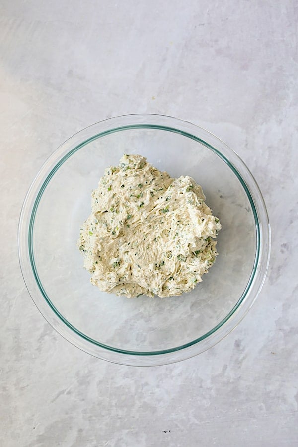Photo of crab filling for artichokes in glass bowl.