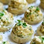 Deviled Crab Stuffed Artichoke Bottoms on white platter.