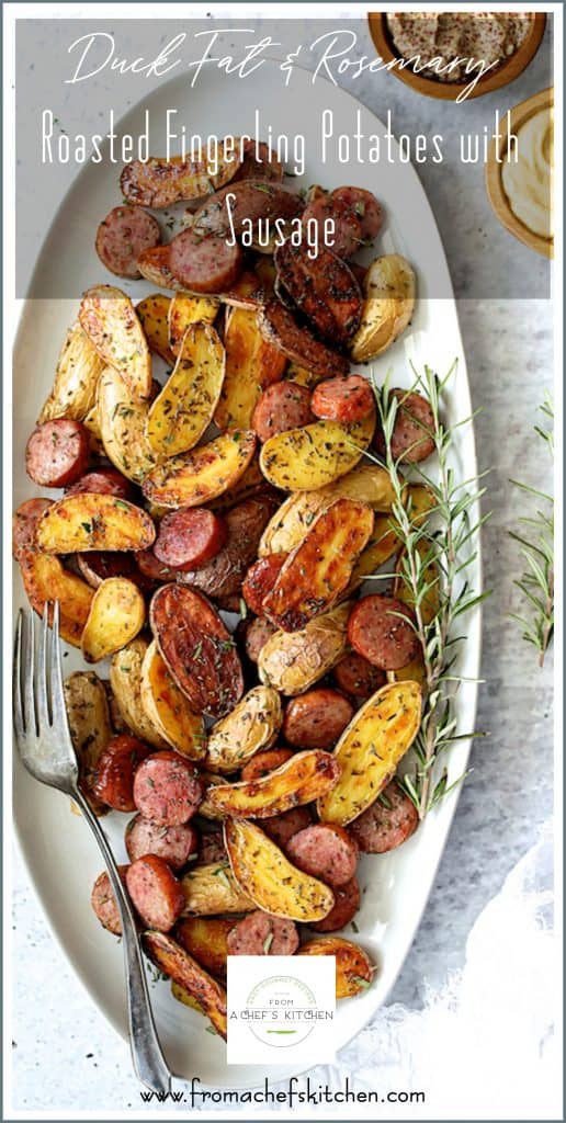 Pinterest graphic for Duck Fat and Rosemary Roasted Fingerling Potatoes with Sausage showing it on an oval white platter.