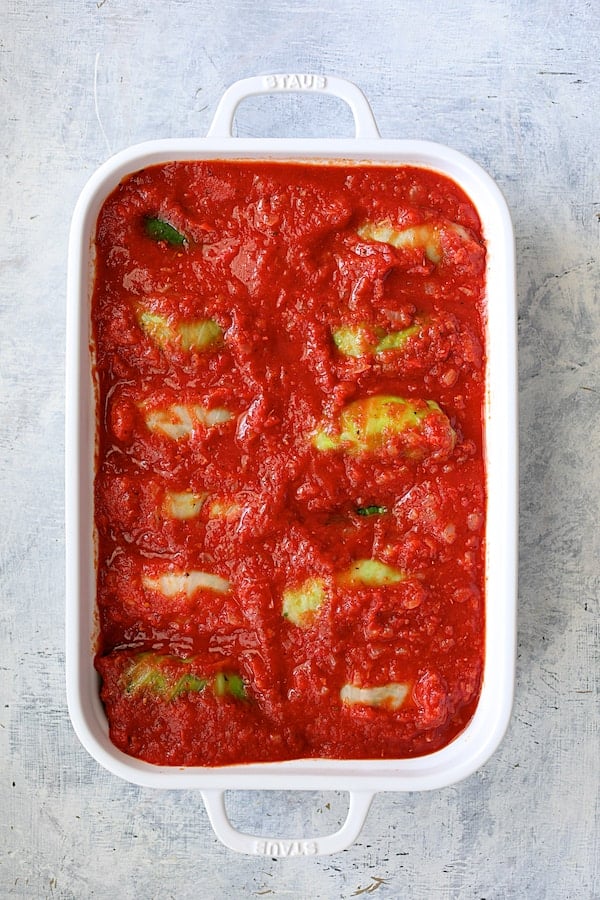 Spicy Italian Stuffed Cabbage - Overhead shot of sauced stuffed cabbage ready to bake
