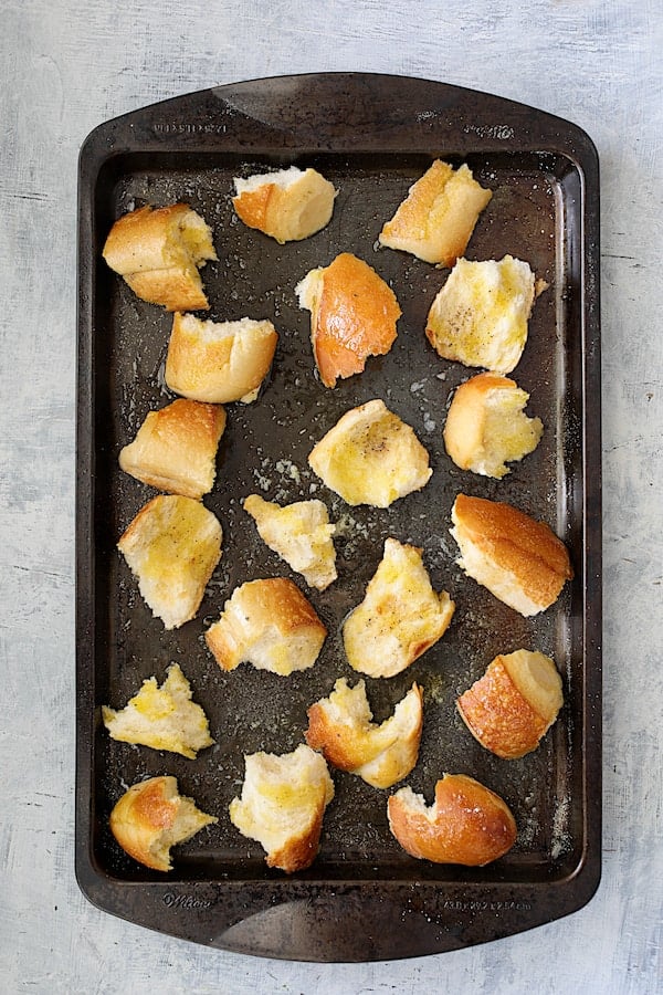 Overhead shot of baked croutons on baking sheet