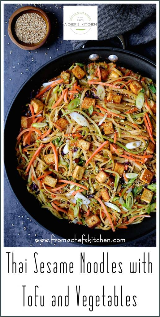 Pinterest graphic for Thai Sesame Noodles with Tofu and Vegetables showing it in a skillet garnished with sesame seeds.