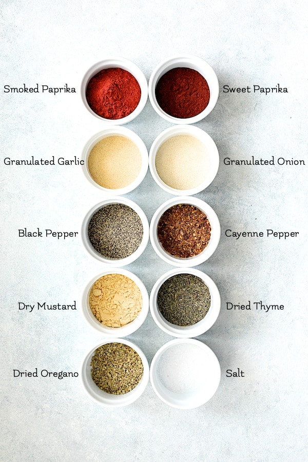 Overhead shot of ingredients for blackening mix in white ramekins