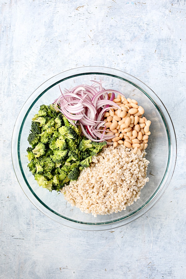 Photo of some of the ingredients for the salad in glass mixing bowl.