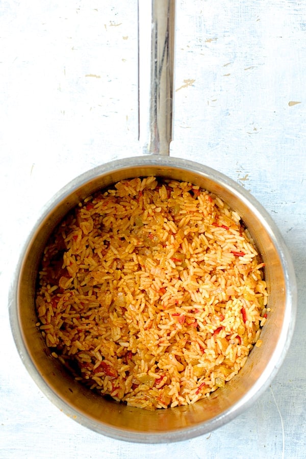 Photo of cooked Spanish rice in saucepan.