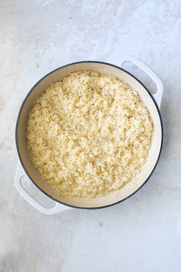 Photo of risotto in cast iron pan after being baked.