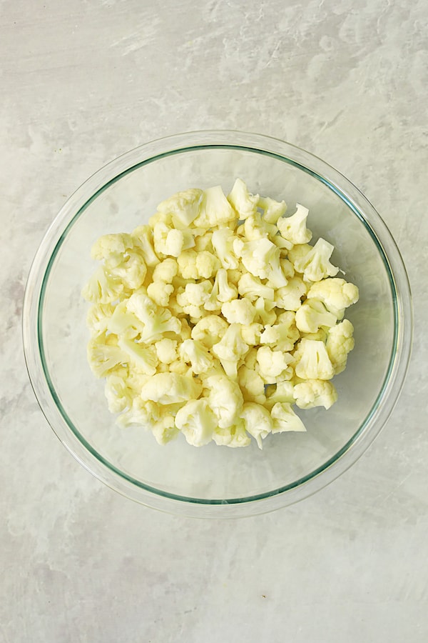 Photo of blanched cauliflower in glass bowl.