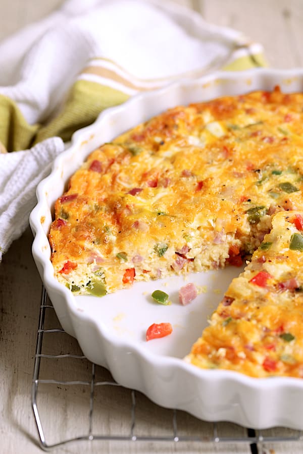 Close-up photo of the interior of Spicy Baked Denver Omelet in white quiche pan.