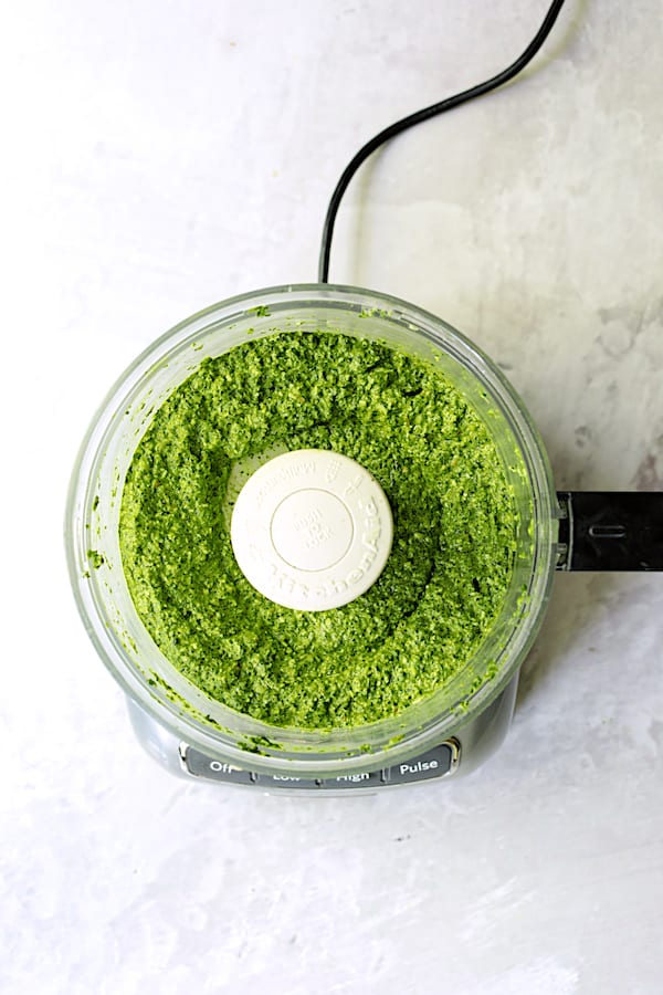 Photo of spinach pesto in food processor.
