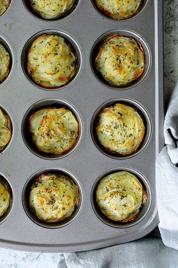 Photo of baked galettes in muffin pan.