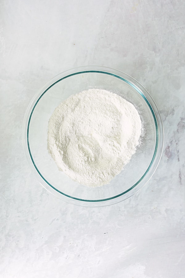 Photo of dry ingredients in glass mixing bowl.