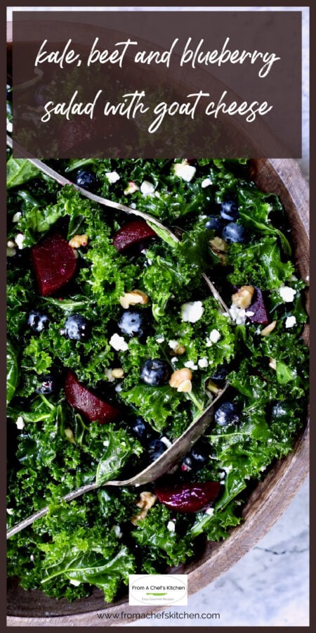 Kale, Beet and Blueberry Salad in wood bowl.