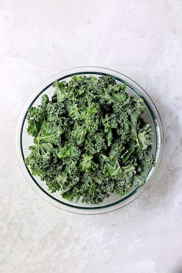 Photo of fresh kale in glass bowl.