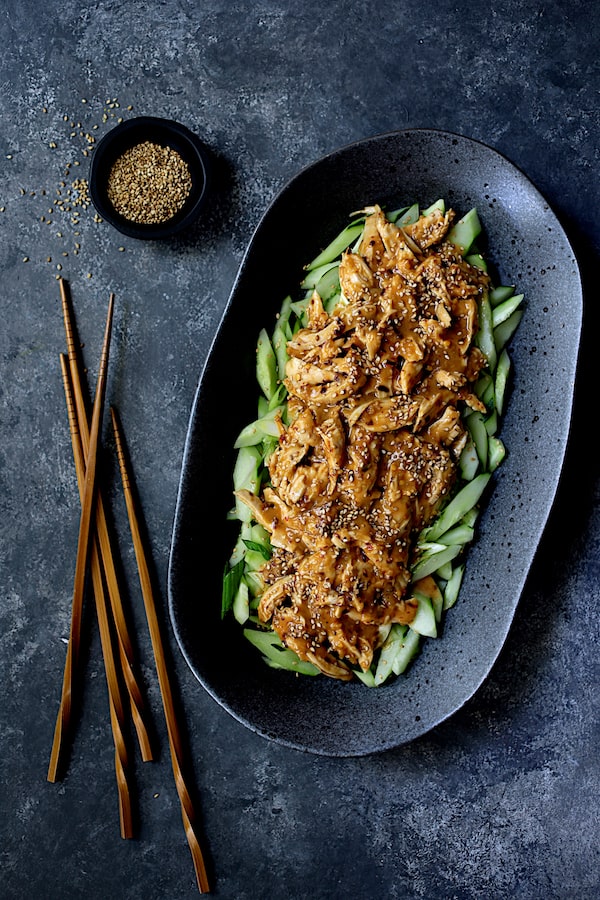 Photo of Sichuan Bang Bang Chicken on black oval platter.