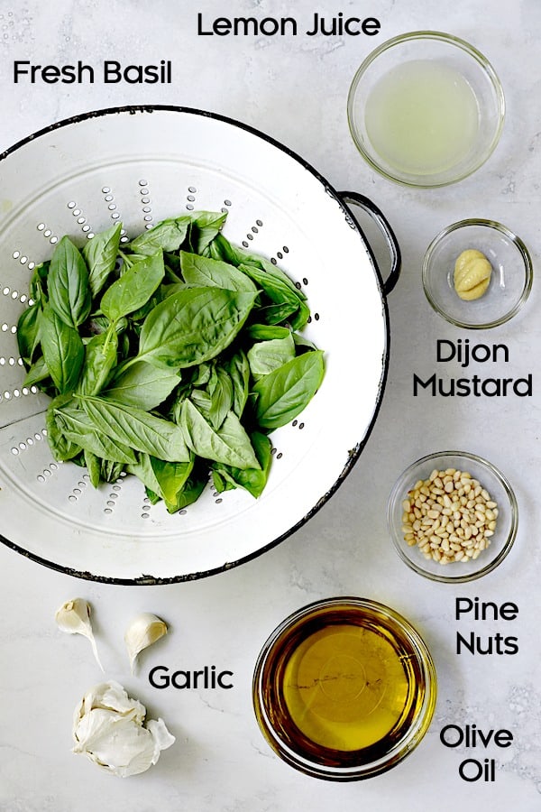 Photo of basil pesto dressing ingredients.