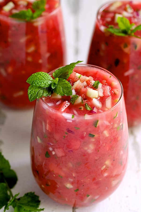 Photo of three glasses of Watermelon Gazpacho with Serrano Chiles and Mint.