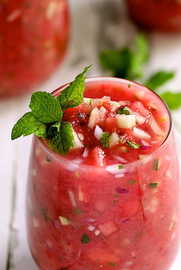 Watermelon Gazpacho with Serrano Chiles and Mint - Close-up shot of gazpacho in glass garnished with fresh mint