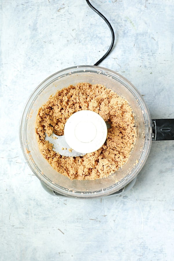 Photo of red lentils being pureed in food processor.