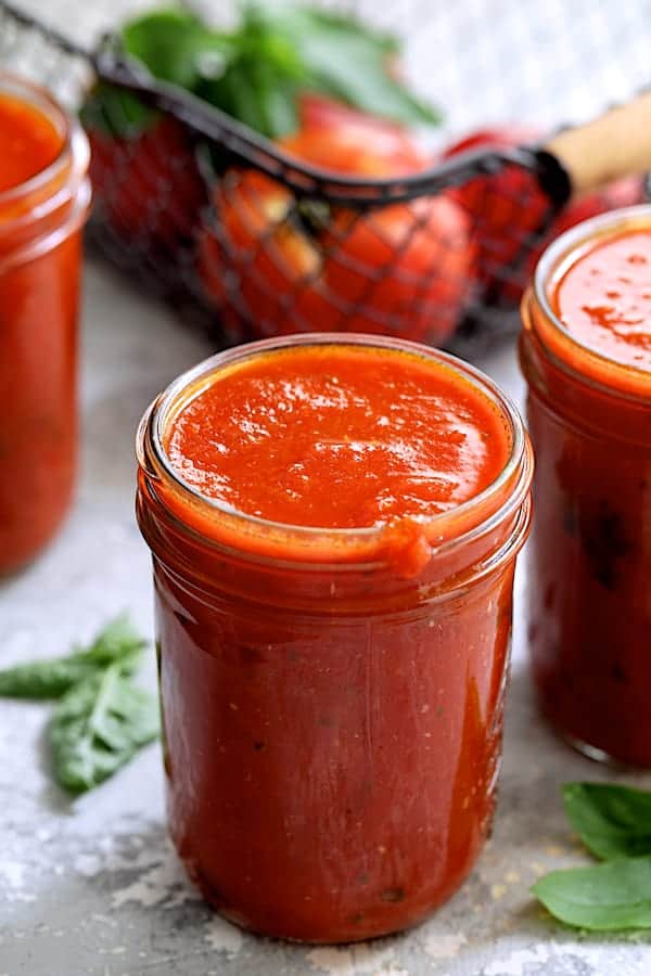 Photo of Basic Fresh Tomato Sauce (Parma Style) in glass pint jars.