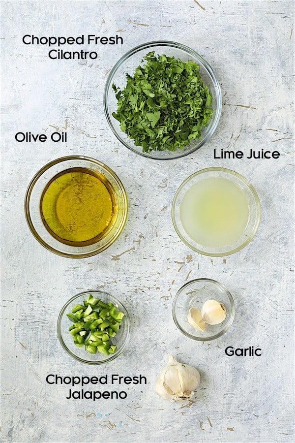 Photo of ingredients for cilantro lime salad dressing in glass bowls.