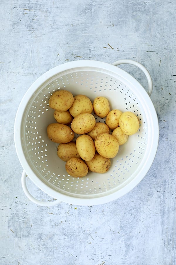 Overhead shot of potatoes in white colander