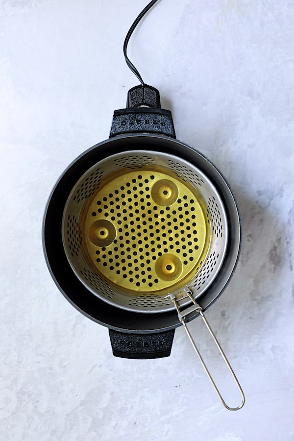 Photo of deep fryer with oil.