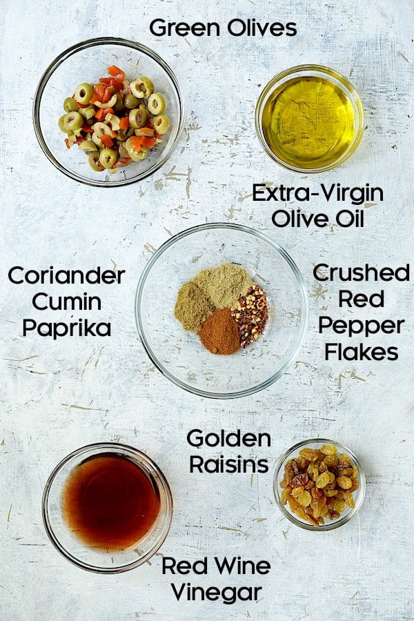 Photo of pantry ingredients for caponata in glass bowls.