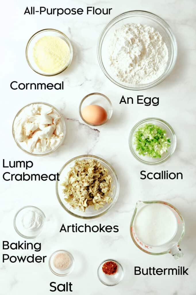 Photo of ingredients for Crab and Artichoke Beignets in glass bowls.