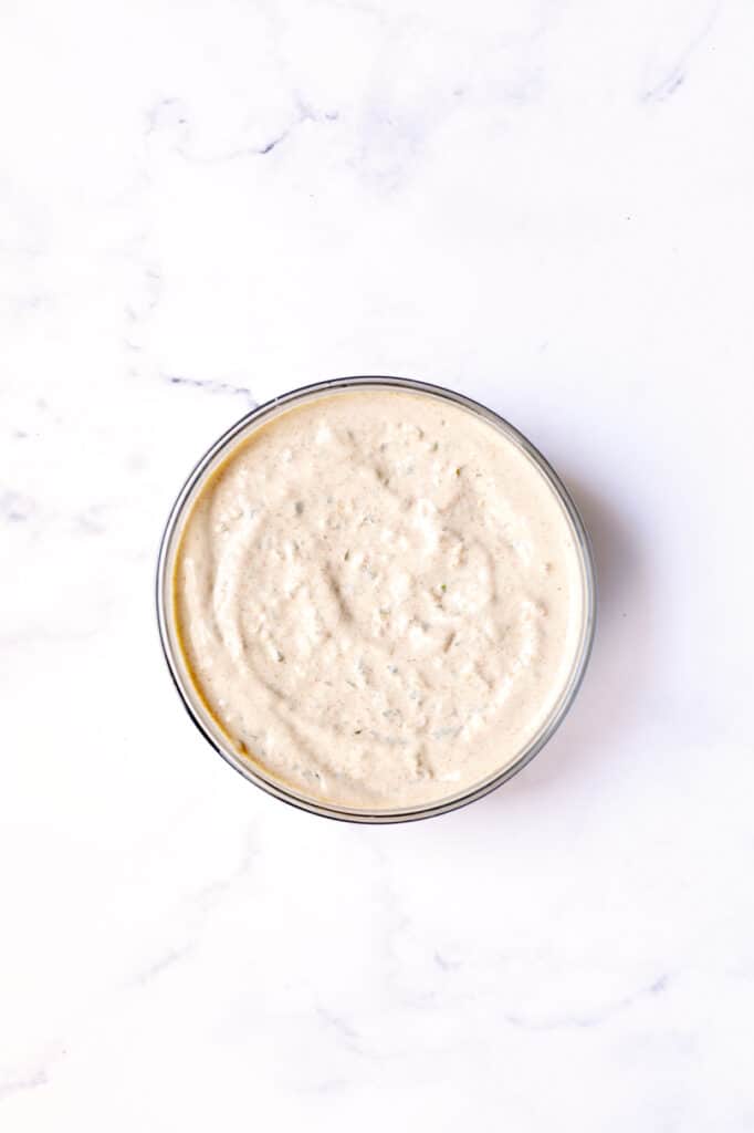 Photo of blended remoulade in glass bowl.
