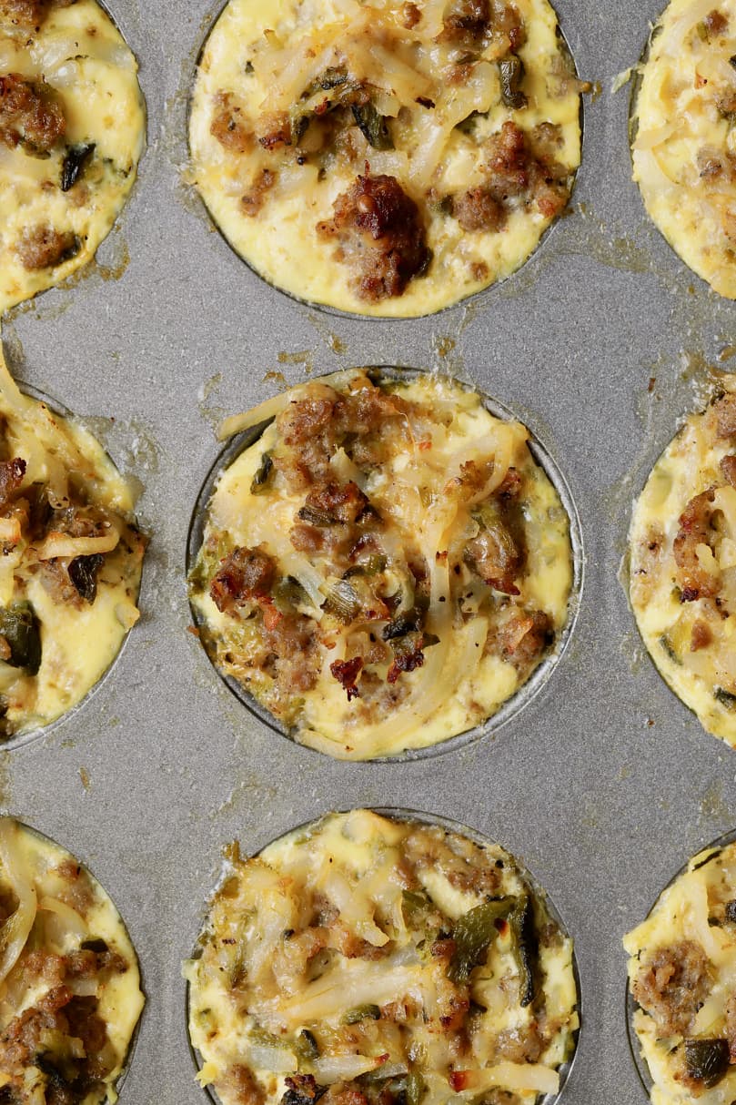 Overhead close-up photo of baked muffins still in muffin pan.