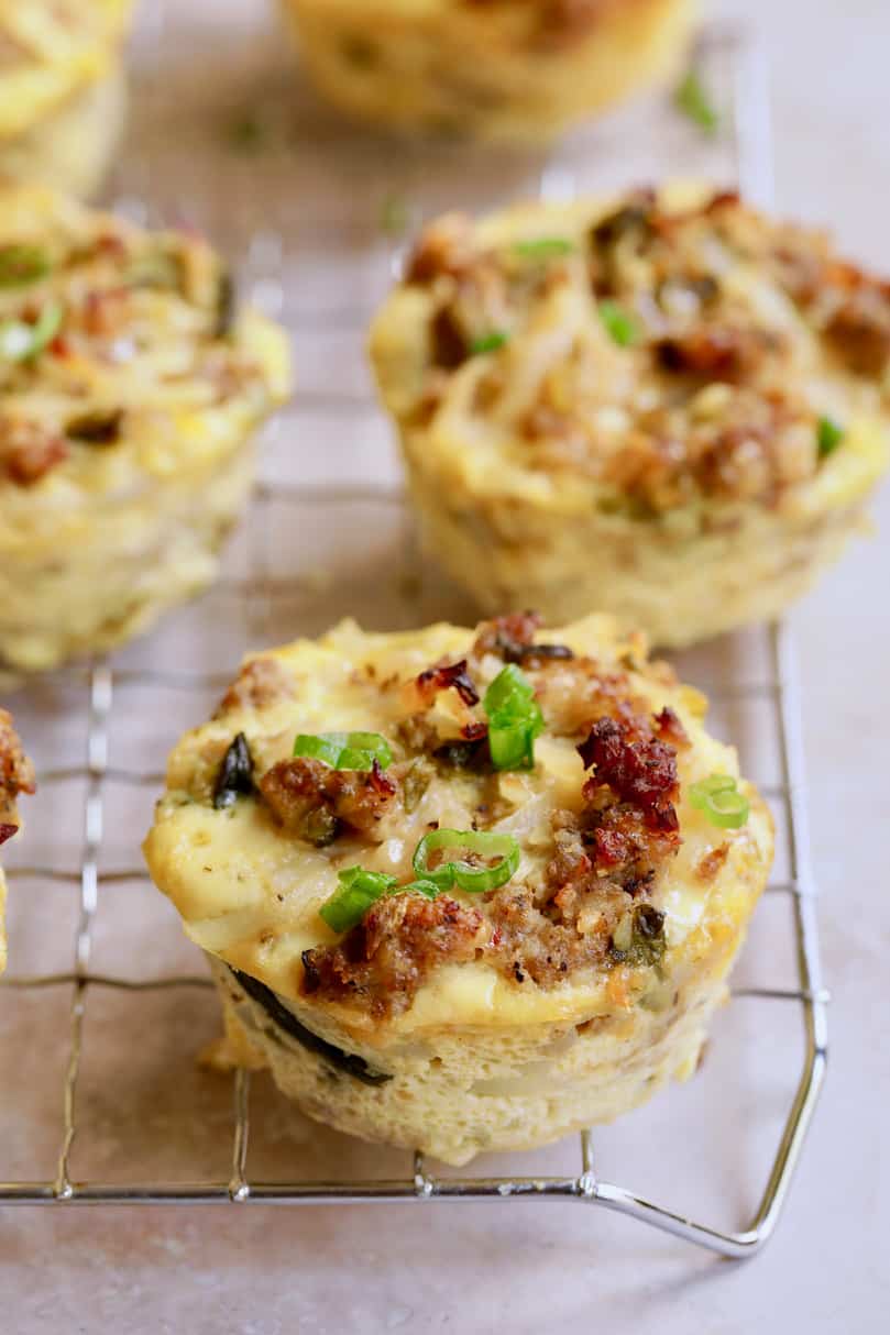 Close-up photo of Hash Brown Breakfast Muffins with Poblano Peppers and Gouda Cheese on cooling rack.