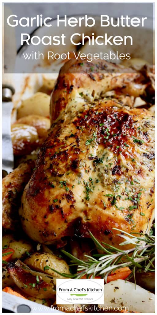 Garlic Herb Butter Roast Chicken with root vegetables in white roasting pan garnished with fresh rosemary.