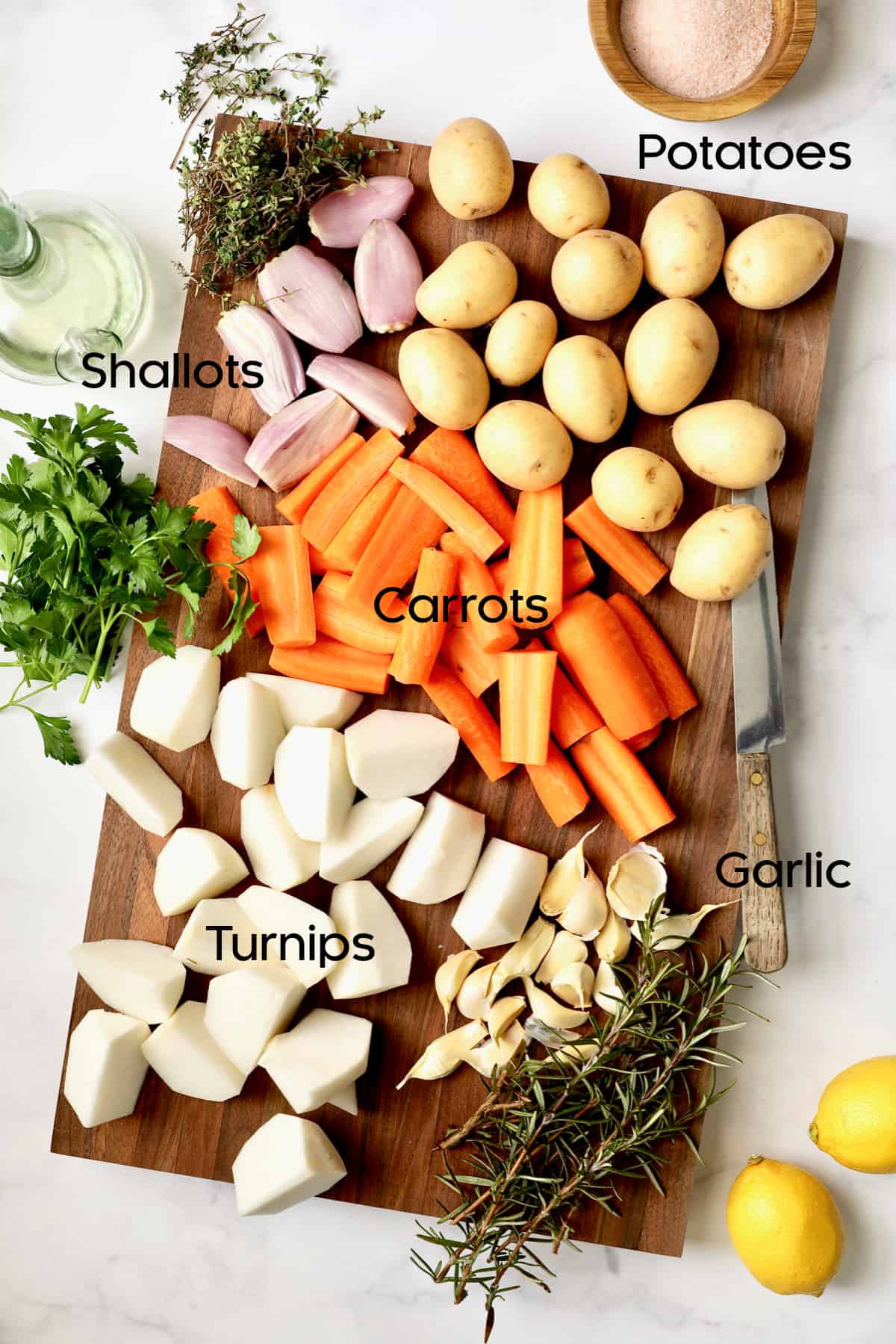 Photo of prepped root vegetables on wood cutting board.