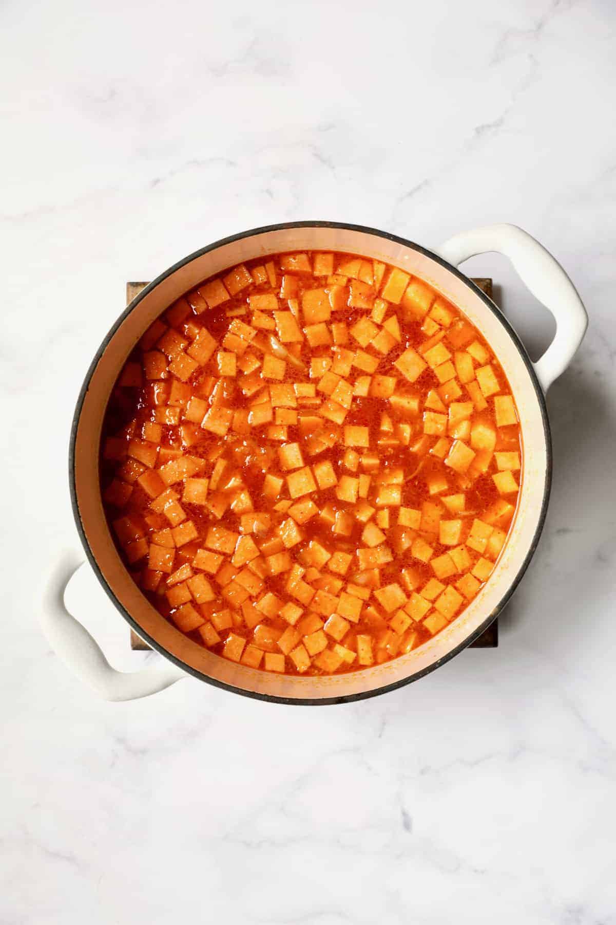 Process photo of Thai Red Curry Sweet Potato and Lentil Soup with sweet potatoes added.