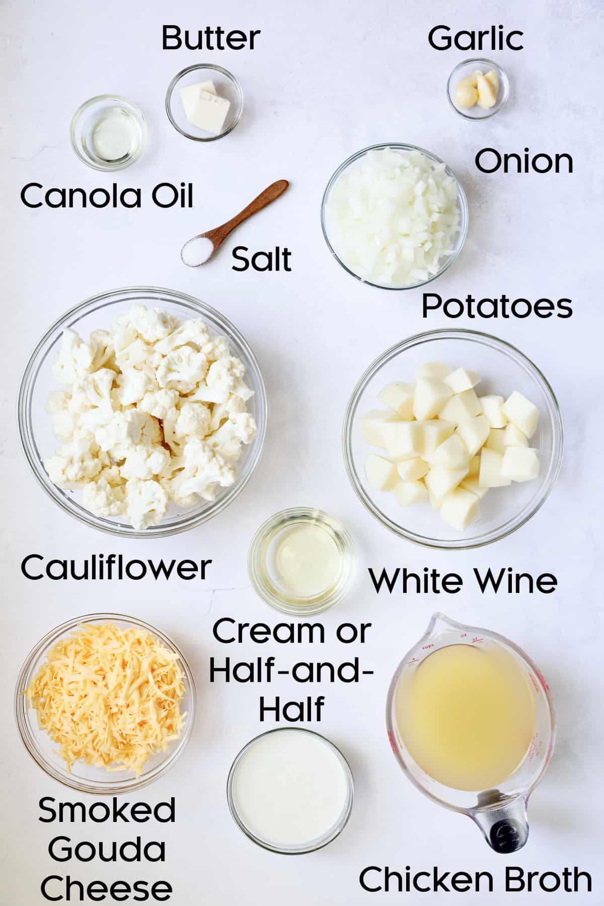 Ingredients for Cauliflower Potato Soup with Smoked Gouda in glass bowls.