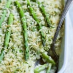 Photo of Creamy Asparagus and Rice Casserole with serving spoon.