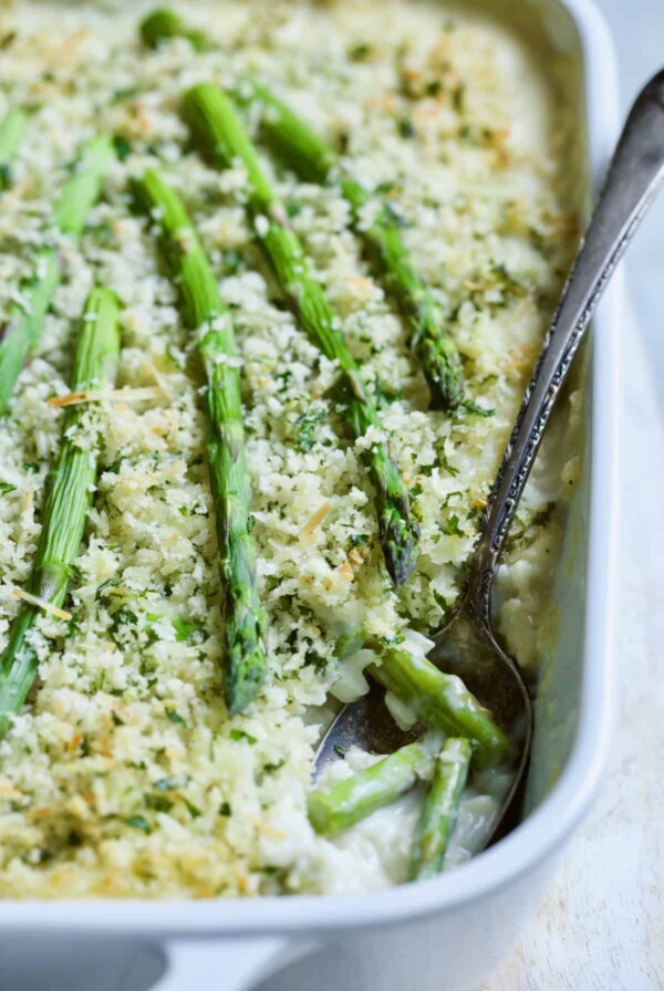 Photo of Creamy Asparagus and Rice Casserole with serving spoon.