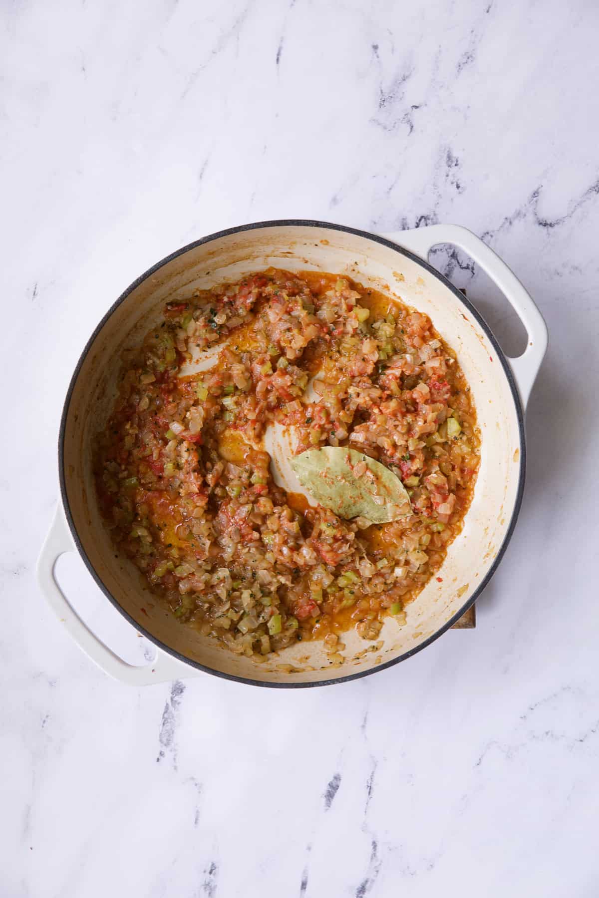Photo of cassoulet after wine and tomato paste has been added.