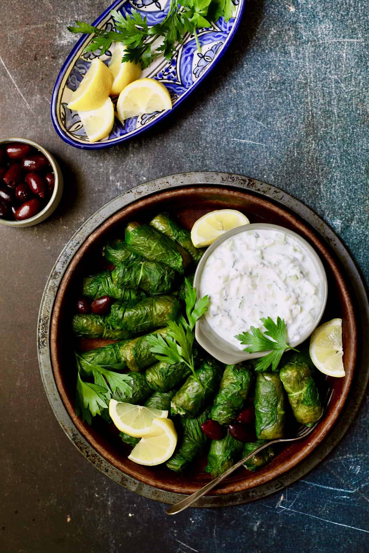 Photo of Swiss Chard and Quinoa Dolmas with Tzatziki with parsley sprigs.