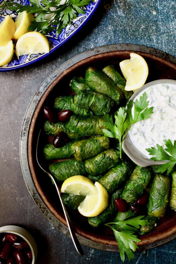 Photo of Quinoa-Stuffed Swiss Chard Dolmas with Tzatziki.