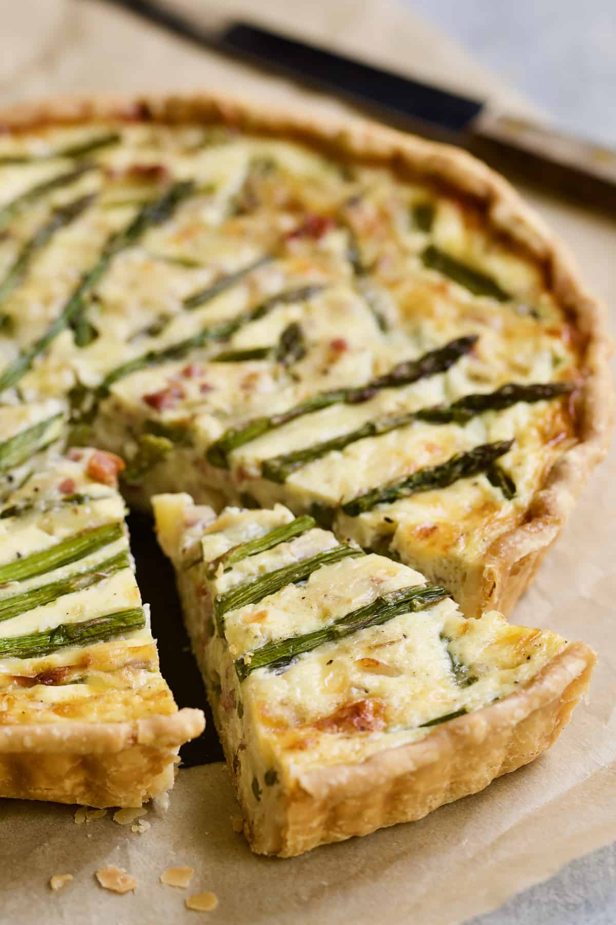 Photo of a piece of Asparagus Prosciutto and Fontina Tart.