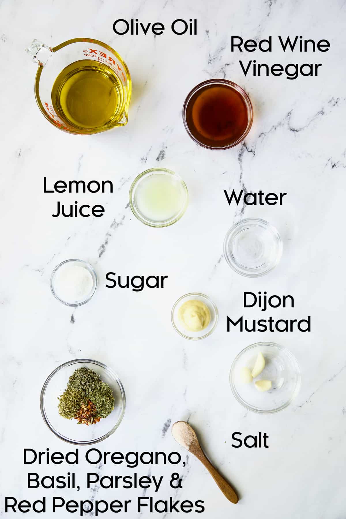 Photo of dressing ingredient for Italian Chopped Salad with Chicken in glass bowls.