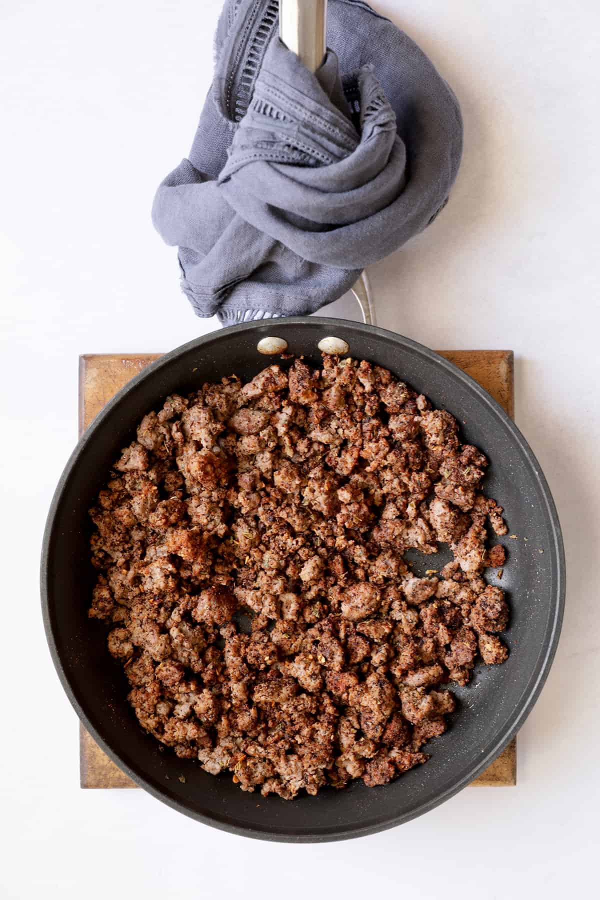 Photo of cooked and browned ground beef in nonstick skillet.