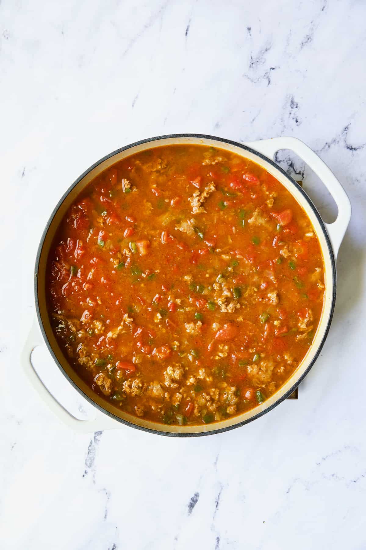 Photo of Unstuffed Chorizo Cabbage Roll Skillet with liquid ingredients added.