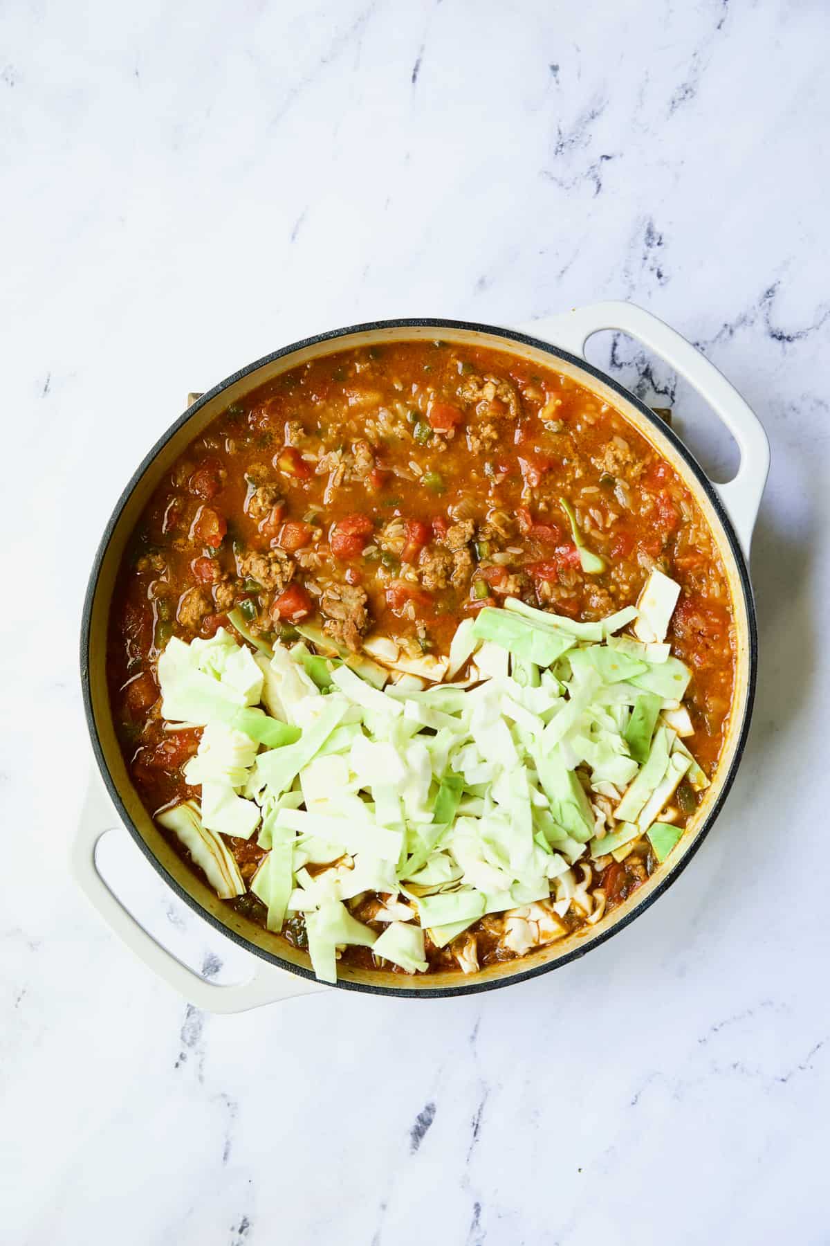 Photo of Unstuffed Chorizo Cabbage Roll Skillet with raw cabbage added.