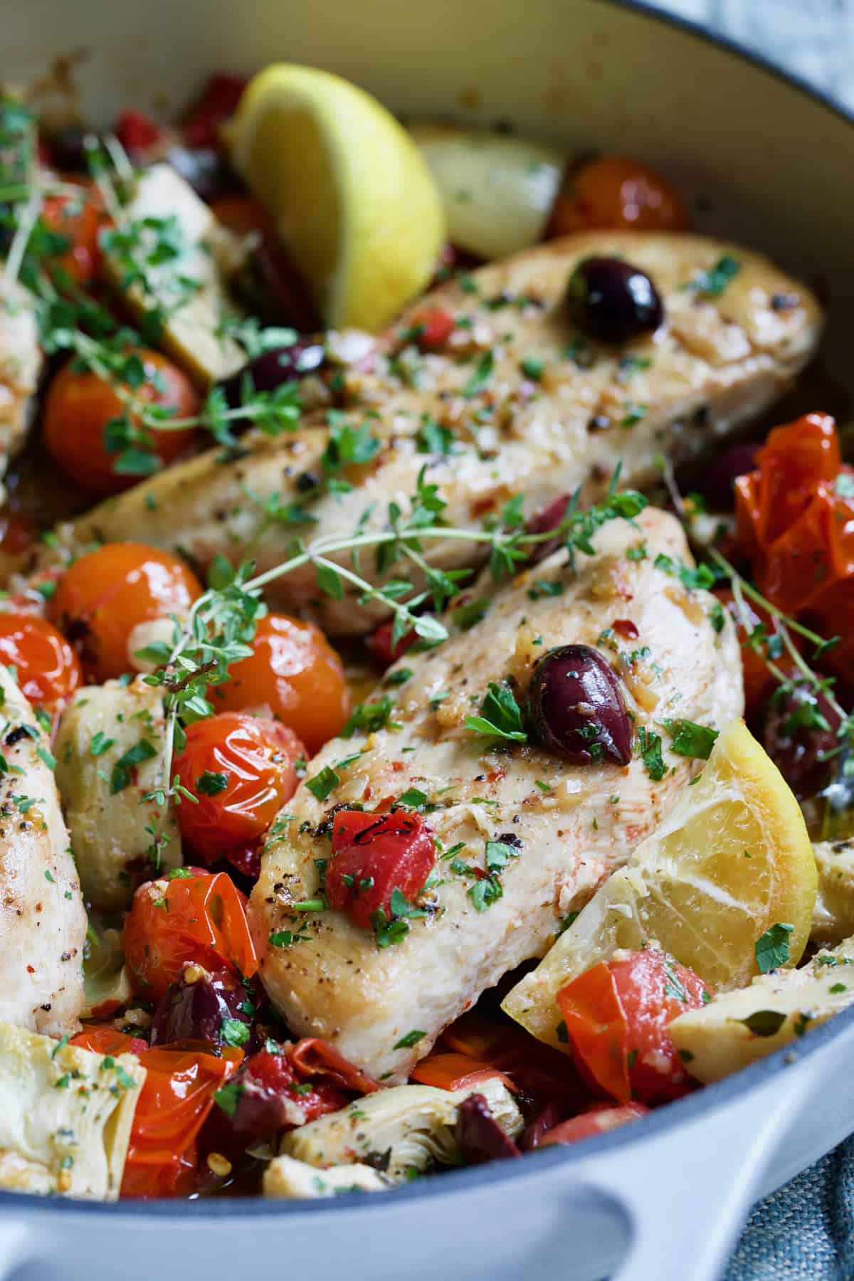 Two of the chicken breasts in Easy Skillet Mediterranean Chicken.