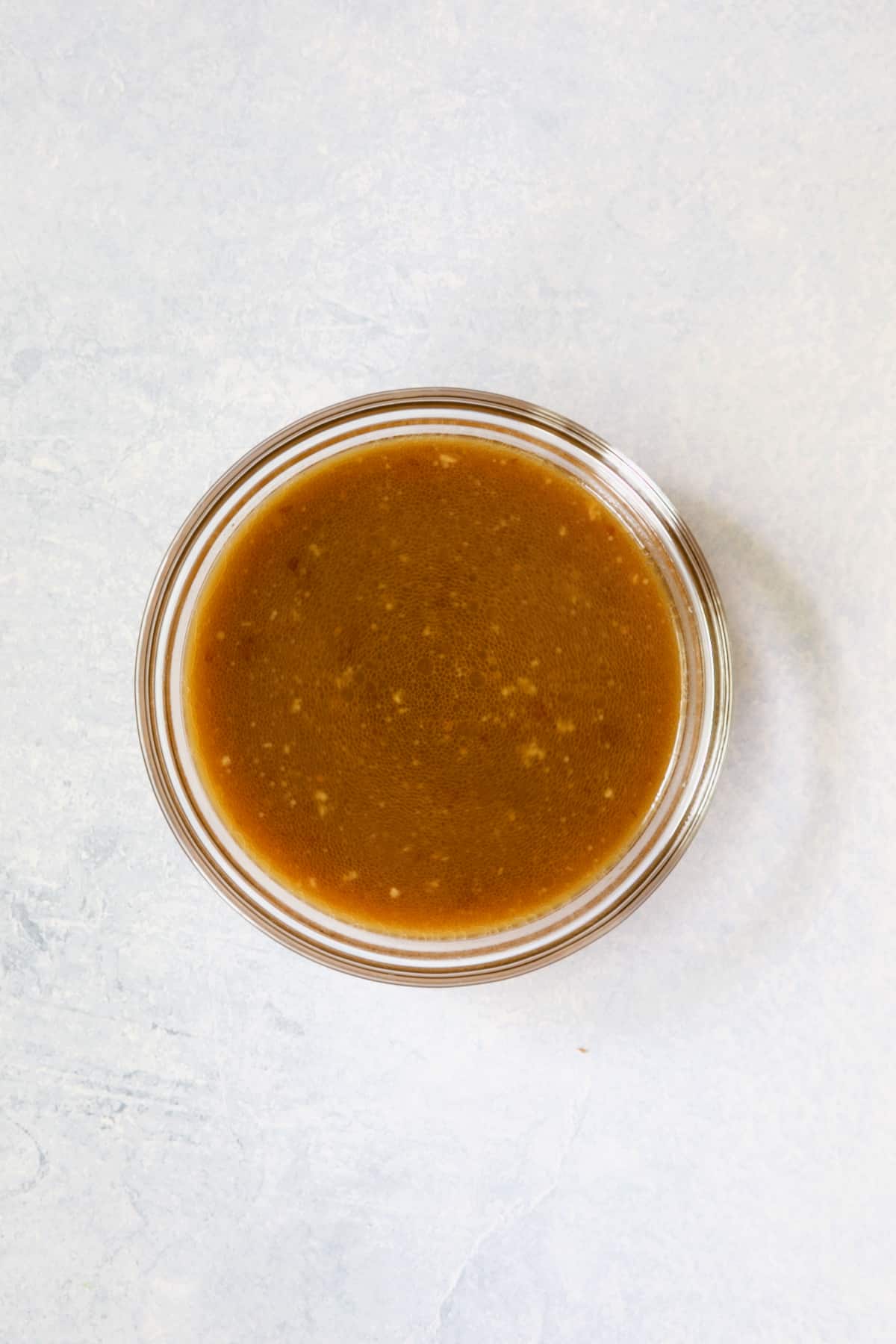 Sauce for Sesame Beef and Asparagus Stir-Fry in glass bowl.