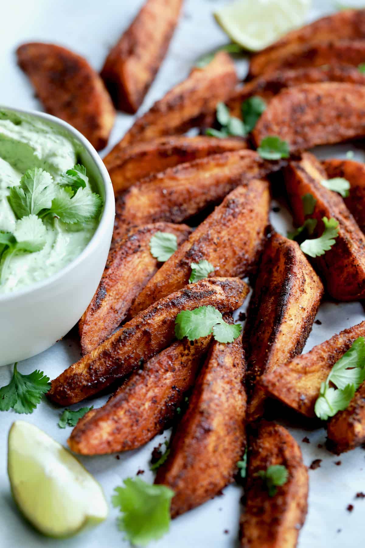 Southwestern Sweet Potato Wedges garnished with cilantro leaves.