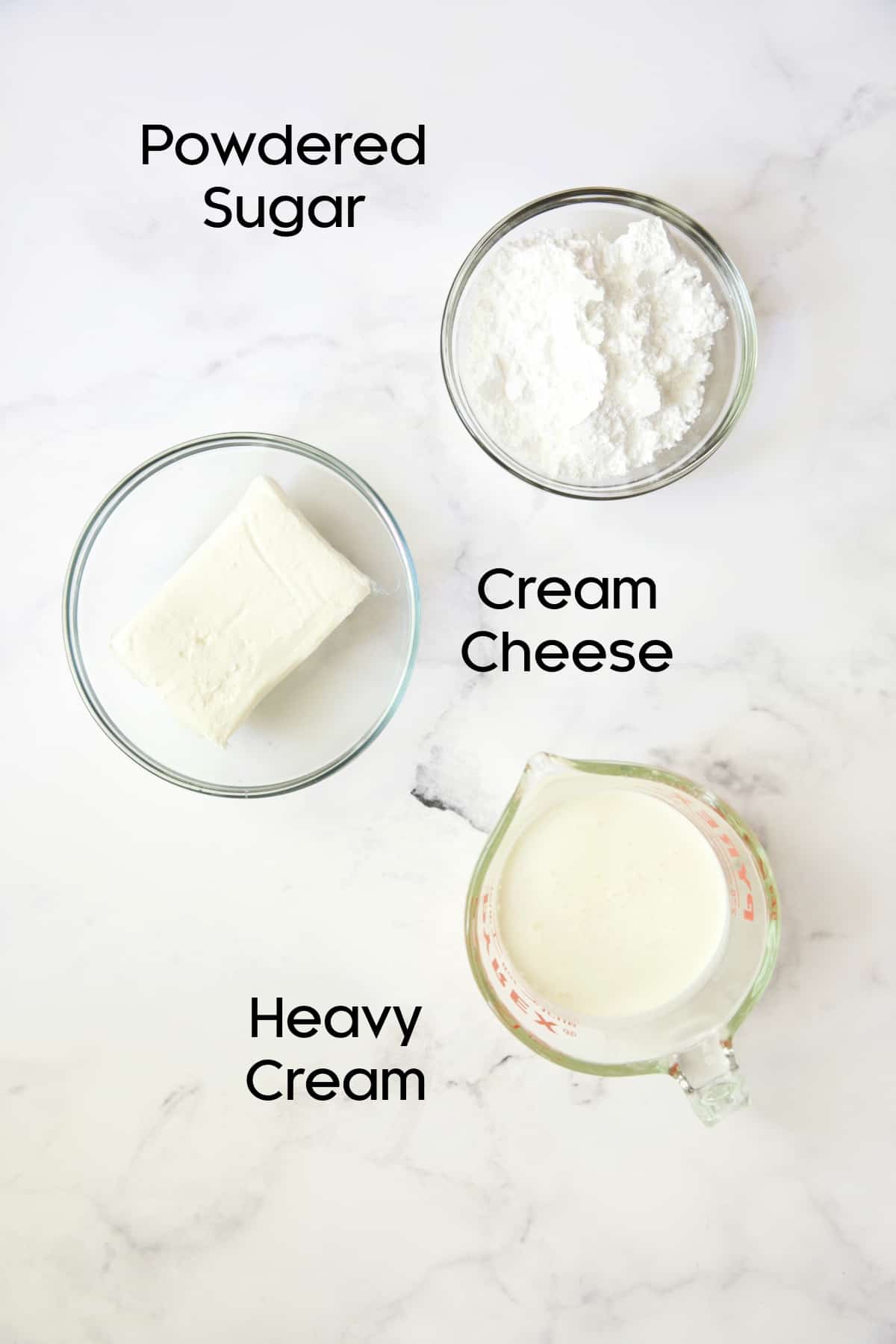 Photo of ingredients for cream cheese layer in glass bowls.